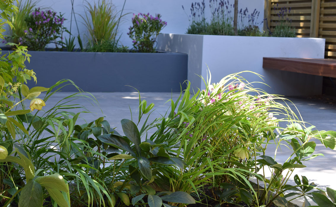 Raised beds painted the same colours as the kitchen units